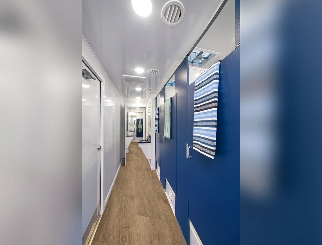 Modern hallway in residential interior with blue accents.
