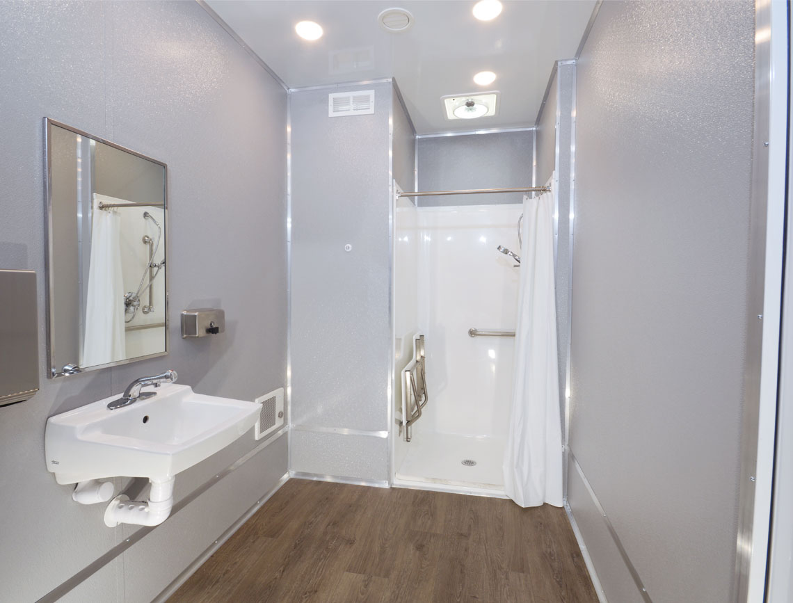 Modern bathroom with shower and sink.