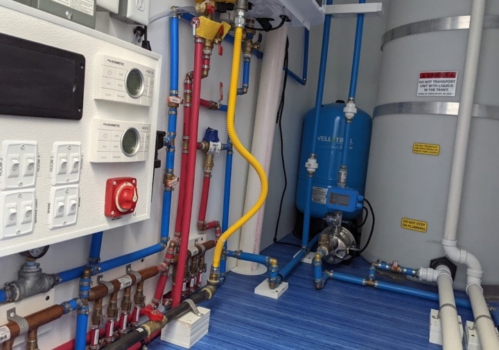 Industrial water filtration system with pipes and tanks.