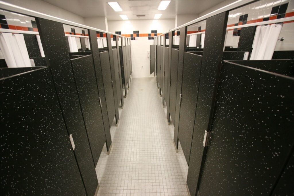 Public restroom interior with multiple stalls.