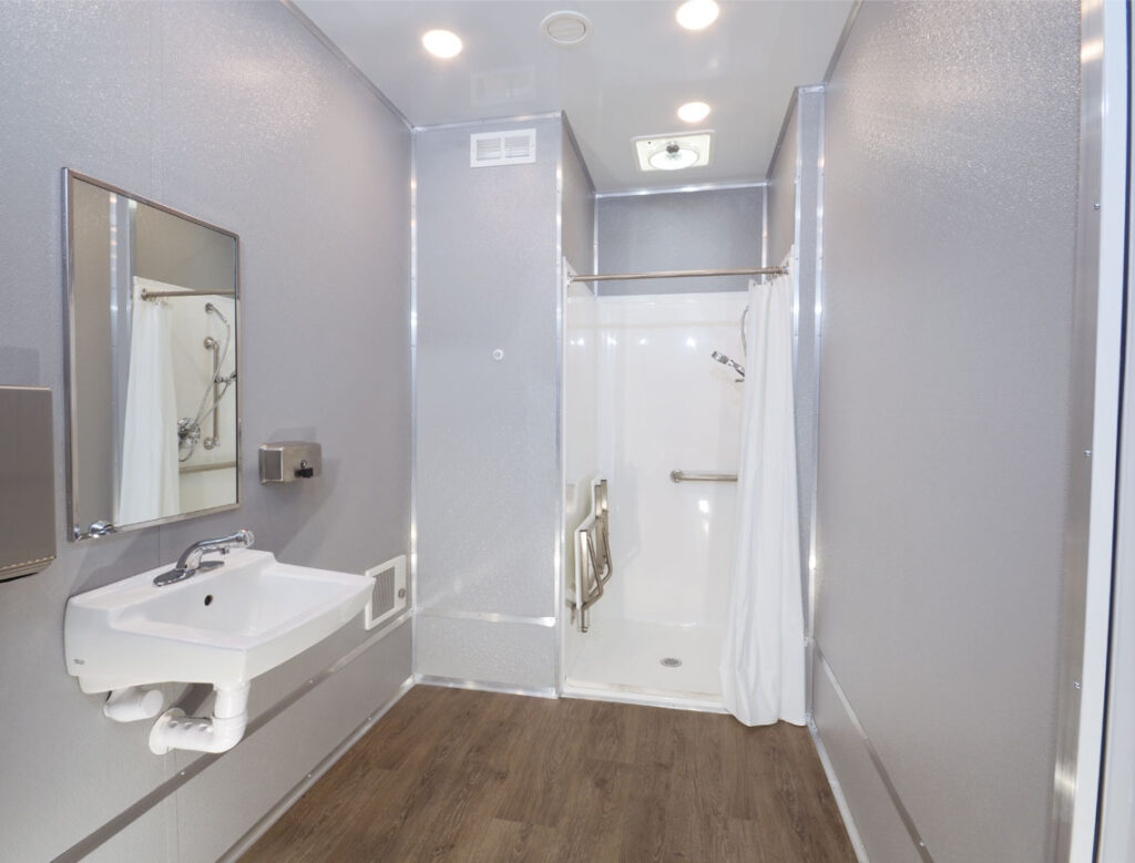 Modern ADA COmpliant shower trailer with shower and sink.