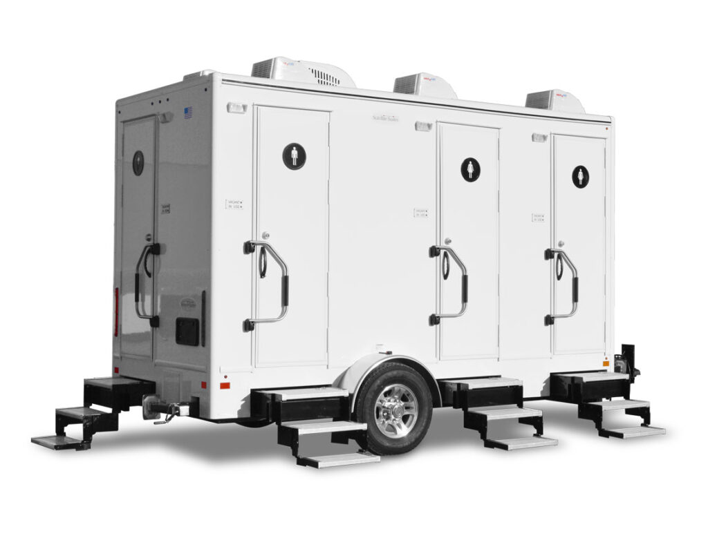 Mobile restroom trailer with three stalls.