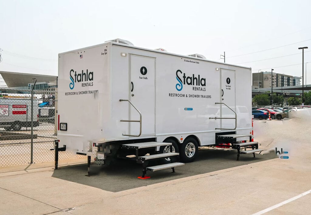Mobile restroom and shower trailer parked outdoors.