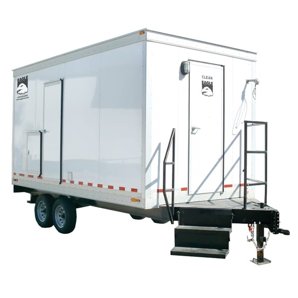 Mobile shower trailer with stairs and safety handrails.