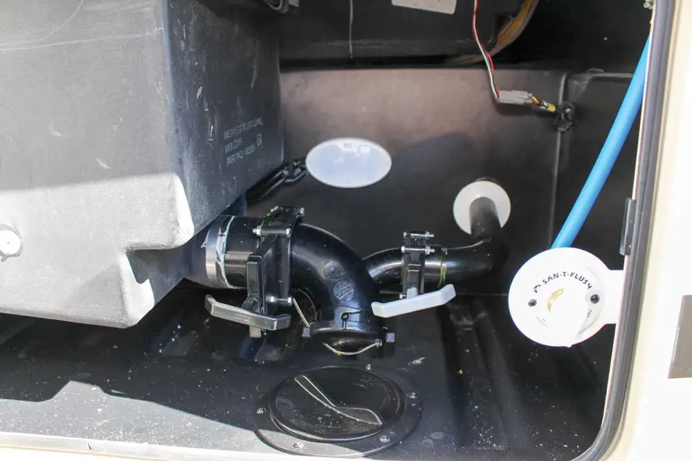 Rv waste disposal connectors and compartment for porta potty waste.