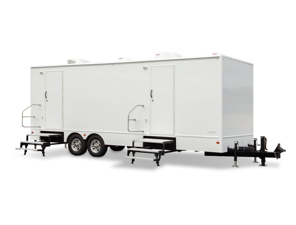 White enclosed trailer with steps on white background.